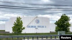 FILE PHOTO: Holding tanks are pictured at Colonial Pipeline's Linden Junction Tank Farm in Woodbridge, New Jersey, U.S., May 10, 2021. REUTERS/Hussein Waaile/File Photo