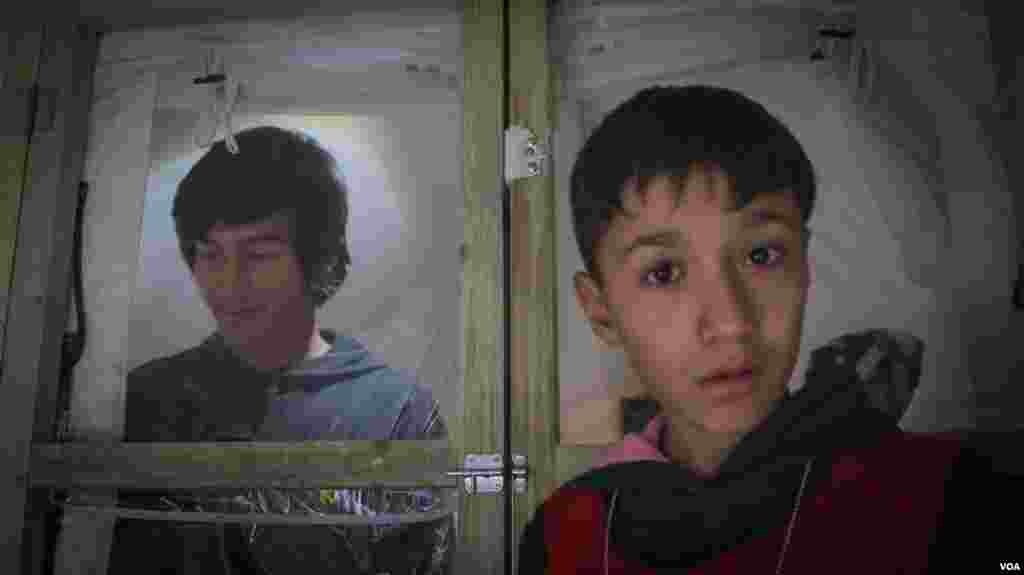 Two youngsters in a tent in Schisto camp. It is expected that the tents in this camp will be replaced by containers in the coming weeks. (J. Owens for VOA)