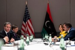 U.S. Secretary of State Antony Blinken, left, speaks as he meets with Libyan Prime Minister Abdulhamid Dabaiba, right, at the Berlin Marriott Hotel in Berlin, Germany, June 24, 2021.