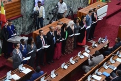 FILE - Ethiopia's newly appointed ministers take their oath of office on Oct. 16, 2018, at the parliament in the capital Addis Ababa.