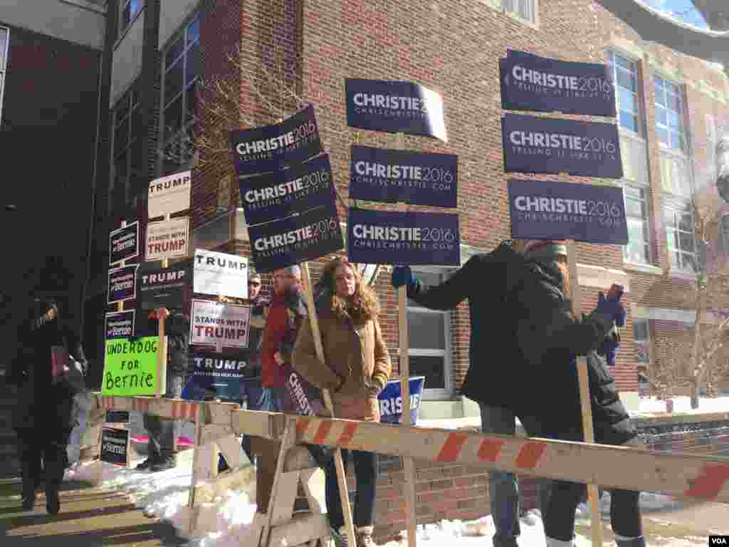 Candidates' posters on display in front of a polling station in Ward 1, Manchester, New Hampshire, Feb. 9, 2016. (Photo: K. Gypson / VOA) 
