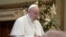 This handout photo taken on December 25, 2020, and released by the Vatican press office, the Vatican Media, shows Pope Francis delivering his live-streamed Urbi et Orbi blessing from the Vatican Blessing hall. (Photo by Handout / VATICAN MEDIA / AFP…