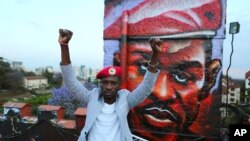 In this photo taken Friday Oct. 12, 2018, Kyadondo MP Robert Kyagulanyi alias Bobi Wine gestures, during a visit to Nairobi, Kenya. 