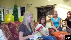 The wine, and maybe the book this bride-to-be has just opened, were probably on her bridal shower gift list.