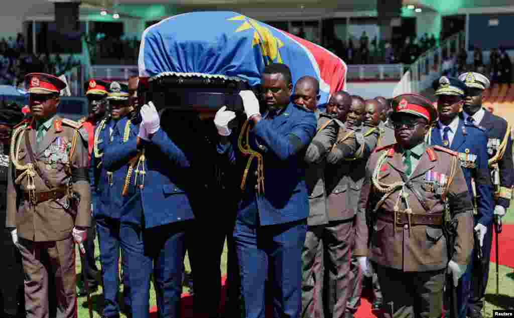 Members of the Namibian military carry the casket with the body of the former president, Sam Nujoma, who became Namibia's first democratically elected president, during his memorial service in Windhoek, Namibia.