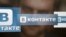 A man looks at a computer screen showing logos of Russian social network VKontakte in an office in Moscow, May 24, 2013. 
