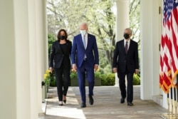 U.S. President Joe Biden speaks is flanked by Vice President Kamala Harris and Attorney General Merrick Garland as he arrives to announce executive actions on gun violence prevention.