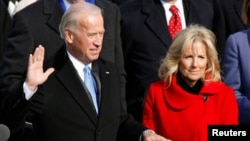 FILE - U.S. Vice President Joe Biden is sworn in as his wife Jill Biden watches during the inauguration of President Barack Obama in Washington, Jan. 20, 2009.
