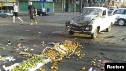 FILE - Damages after a suicide bomb attack are seen in Sweida, Syria, July 25, 2018. (Sana/Handout via Reuters)