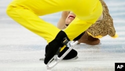 Stefania Berton and Ondrej Hotarek of Italy compete in the team pairs short program figure skating competition at the Iceberg Skating Palace during the 2014 Winter Olympics in Sochi, Feb. 6, 2014.