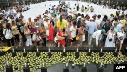 Survivors and relatives of the victims of the 2002 Bali bombings attend a ceremony marking the 10th anniversary of the Bali attacks at the Garuda Wisnu Kencana cultural park in Jimbaran located in Indonesia's resort island of Bali, October 12, 2012.