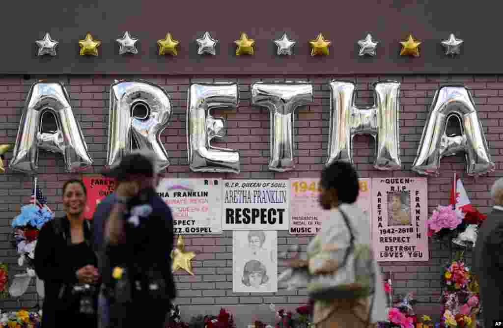 People gather outside New Bethel Baptist Church before a viewing for Aretha Franklin, Aug. 30, 2018, in Detroit. 