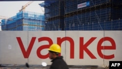 中國房地產巨頭萬科在管理層改組以及近日獲得中國政府罕見的加強支持後，推動該公司股價彈漲。 (法新社：2024年3月31日)