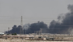 Smoke is seen following a drone attack on an Aramco oil facility in the eastern city of Abqaiq, Saudi Arabia, Sept. 14, 2019.