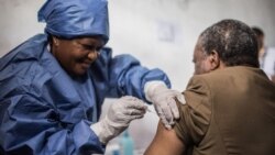 Dr. Jean-Jacques Muyembe Tamfun gets inoculated with an Ebola vaccine in Goma, DRC, Nov. 22, 2019.