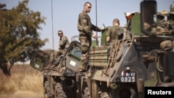 Black smoke rises from a Ukrainian Army helicopter that was shot down outside Slovyansk, Ukraine, May 29, 2014.