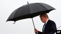 President Donald Trump walks down the steps of Air Force One at Osaka International (Itami) Airport, in Osaka, Japan, June 27, 2019. Trump is in Osaka to attend the G-20 summit. 