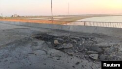 A view shows the damaged Chonhar bridge connecting Russian-held parts of Ukraine's Kherson region to the Crimean peninsula