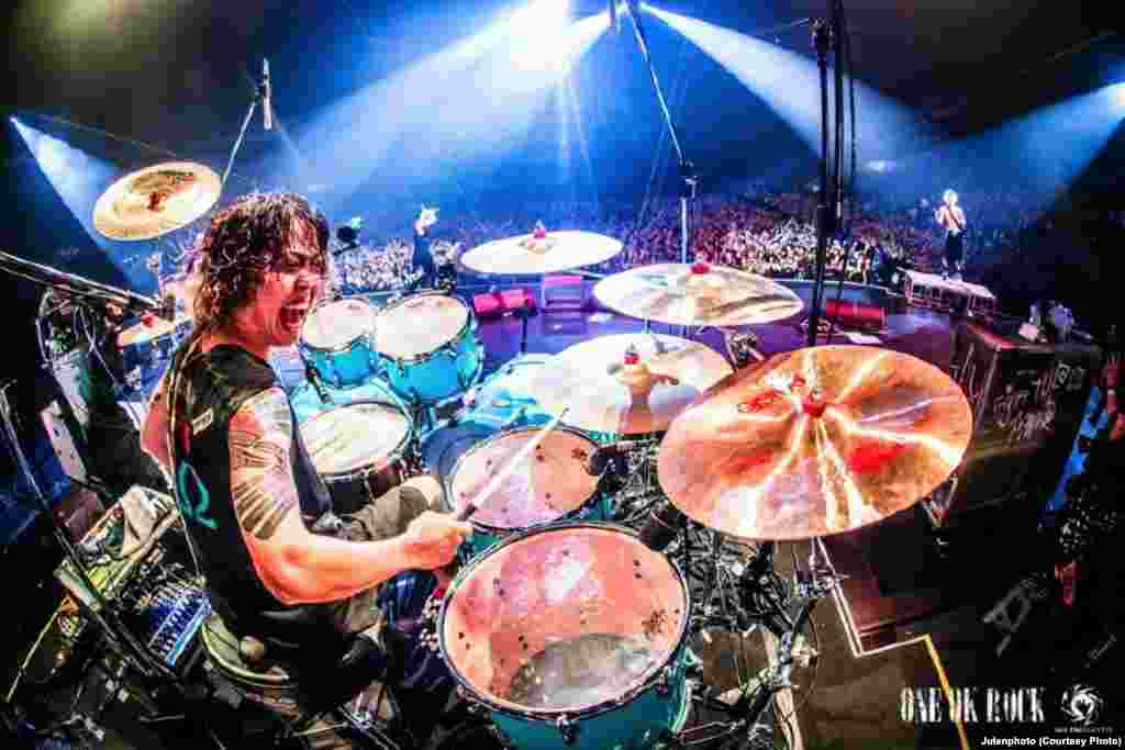 Performing in Japan on their '35xxxv' tour, 2015