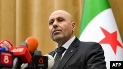 የሶሪያ መርማሪ ኮሚቴ ቃል አቀባይ ያሲር አል ፋርሃን መግለጫ ሲሰጡ፣ መጋቢት 2 ቀን 2017 ዓ.ም.