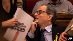 FILE - Separatist lawmaker Quim Torra, candidate for regional president, is pictured during a parliamentary session in Barcelona, Spain, May 12, 2018. 