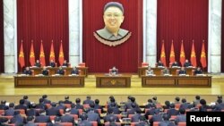 Palestinian protesters run for cover from stun grenades fired by Israeli troops during a protest against the visit of Israeli President Reuven Rivlin to the occupied West Bank city of Hebron.
