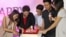 Google officials and partners cut into a birthday cake marking YouTube's first year with a Vietnamese version. (Lien Hoang/VOA News)