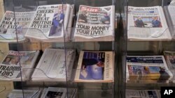 A selection of British national newspapers on sale at newsagents in London, March 30, 2017. 