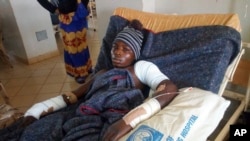 FILE - A man receives treatment at the Jos University teaching hospital in Jos, Nigeria, June 25, 2018, after clashes in central Nigeria between mostly Muslim herders and Christian farmers. 