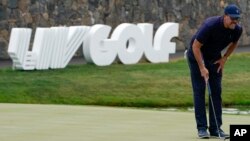 FILE - Phil Mickelson lines up a shot on the 18th hole during the first round of the Bedminster Invitational LIV Golf tournament in Bedminster, N.J., July 29, 2022. (AP Photo/Seth Wenig, File)