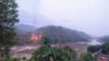 This handout from Kawthoolei Today taken and released on April 27, 2021 shows fires burning at a Myanmar military base along the bank of the Salween river, as seen from Mae Sam Laep town in Thailand's Mae Hong Son province, after the base was attacked and