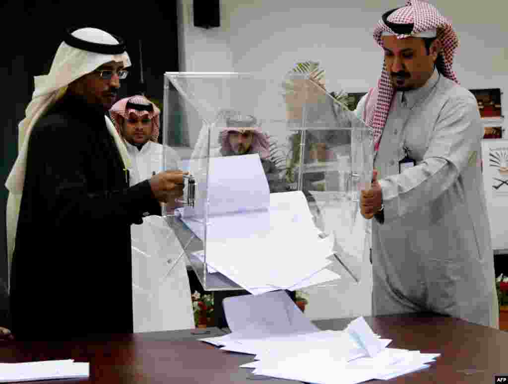 Saudi election officials prepare to count votes at the end of the municipal elections.