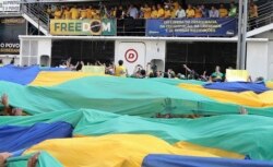 Brazilian President Jair Bolsonaro delivers a speech during a demonstration in his support in Sao Paulo, Brazil, on September 7, 2021, on Brazil's Independence Day. - Fighting record-low poll numbers, a weakening economy and a judiciary he says is…