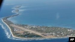 FILE - Funafuti, the main island of the nation state of Tuvalu, is photographed from a Royal New Zealand airforce C130 aircraft as it approaches the tiny South Pacific nation.