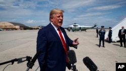 President Donald Trump talks with reporters after arriving at Joint Base Andrews, Sept. 26, 2019, in Maryland. 