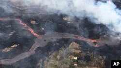 This May 23, 2018, photo shows a helicopter overflight of Kīlauea volcano's lower East Rift Zone near Pahoa, Hawaii. 